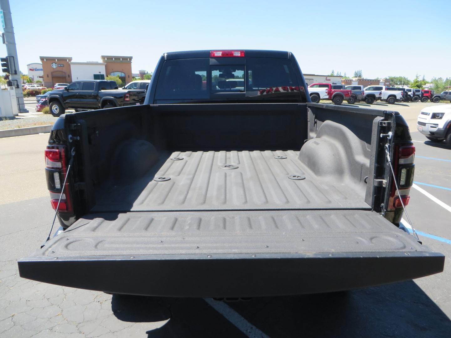 2023 BLACK /BLACK RAM 2500 Laramie Crew Cab SWB 4WD (3C6UR5FL0PG) with an 6.7L L6 OHV 24V TURBO DIESEL engine, 6A transmission, located at 2630 Grass Valley Highway, Auburn, CA, 95603, (530) 508-5100, 38.937893, -121.095482 - Features a new BDS 4" Long Arm suspension system, Fox shocks, 37" Toyo RT Trail tires, and 20" XD Buck wheels. Also has Factory 5th wheel prep. - Photo#11